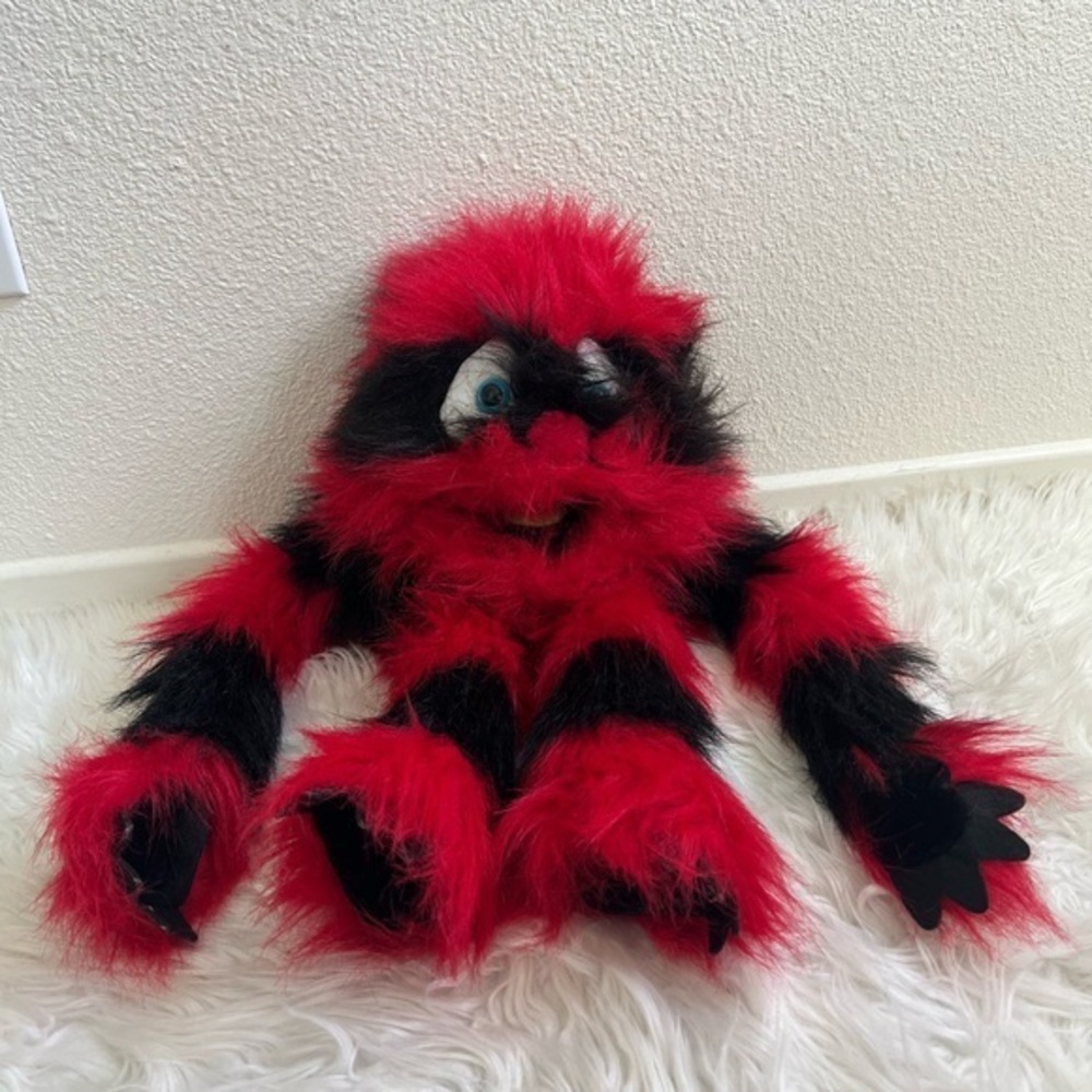 The puppet company red and black squeaker monster puppet